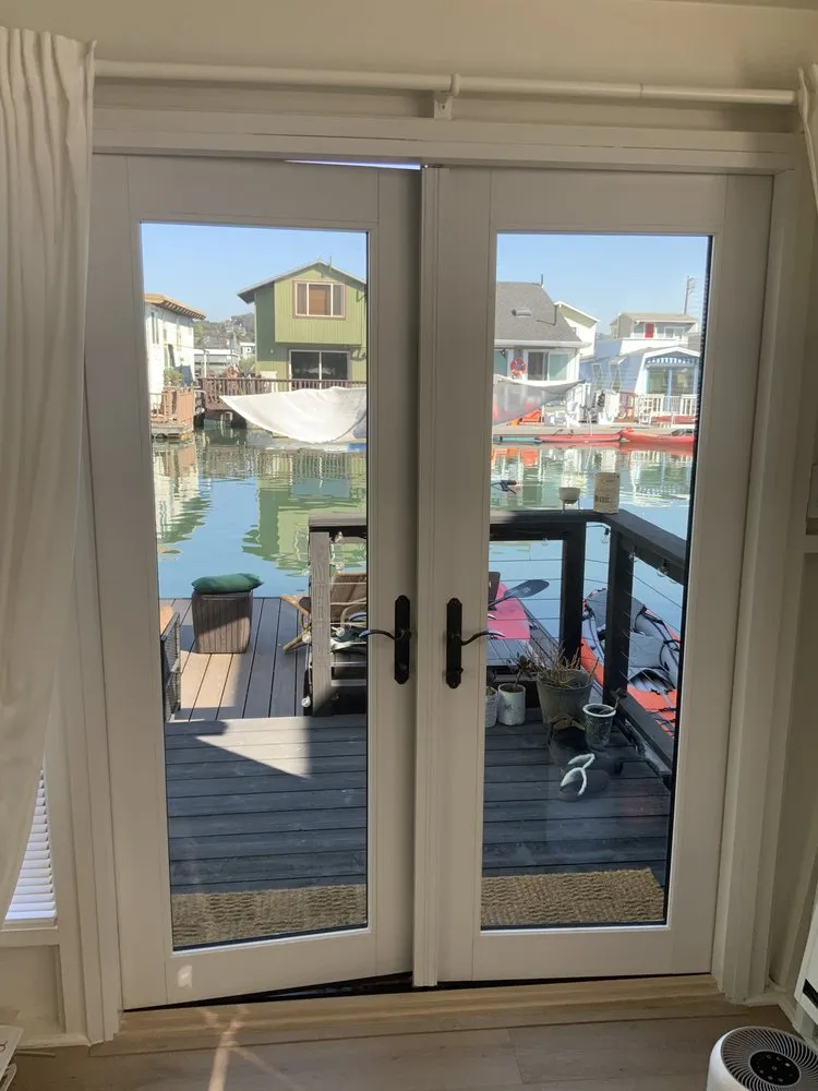 White French patio doors opening onto a dock